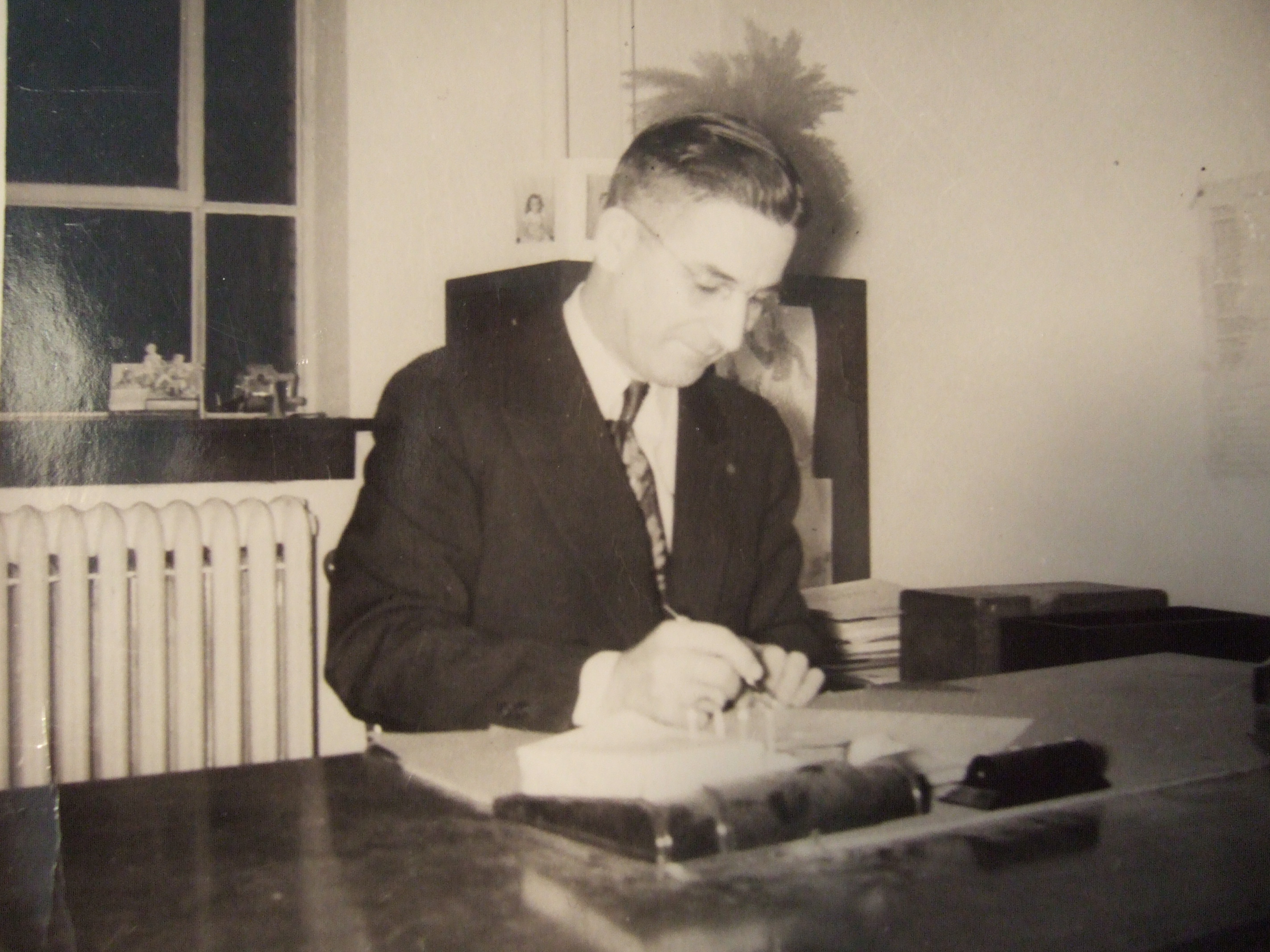 5. Marion Howard at his desk, Longfellow School